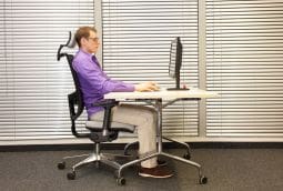 blog picture of man sitting at desk in ergonomic chair