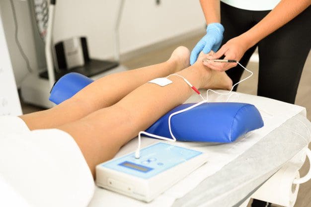 Image of medium frequency electrotherapy being applied to patient.